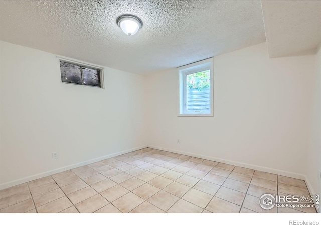 131 E 15th Ave, Longmont, CO 80504 - unfurnished room with a textured ceiling and light tile patterned floors