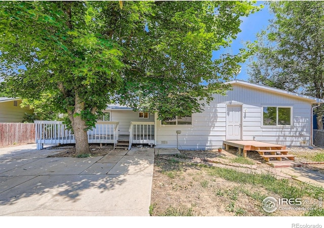 131 E 15th Ave, Longmont, CO 80504 - view of front of home featuring a wooden deck