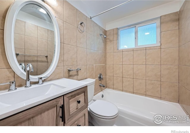 131 E 15th Ave, Longmont, CO 80504 - full bath with shower / tub combination, tile walls, and vanity