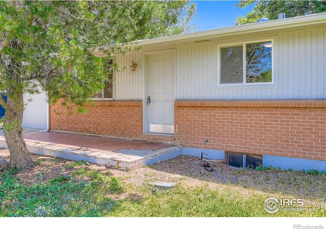 131 E 15th Ave, Longmont, CO 80504 - view of exterior entry featuring brick siding