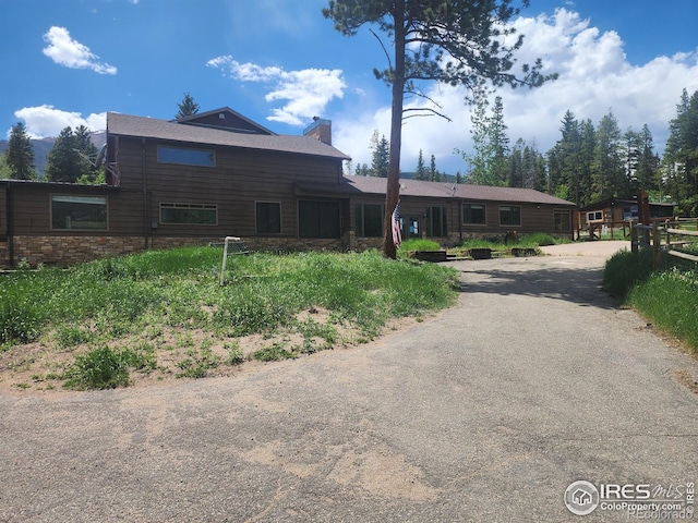 8451 Peak To Peak Hwy, Allenspark, CO 80510 - view of front of home featuring a chimney