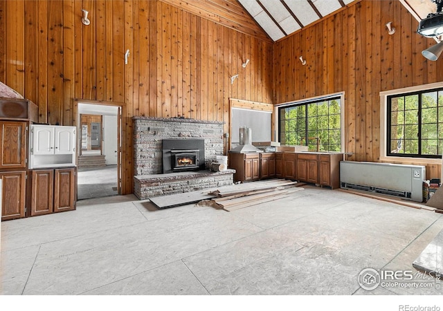 8451 Peak To Peak Hwy, Allenspark, CO 80510 - unfurnished living room with high vaulted ceiling and wooden walls