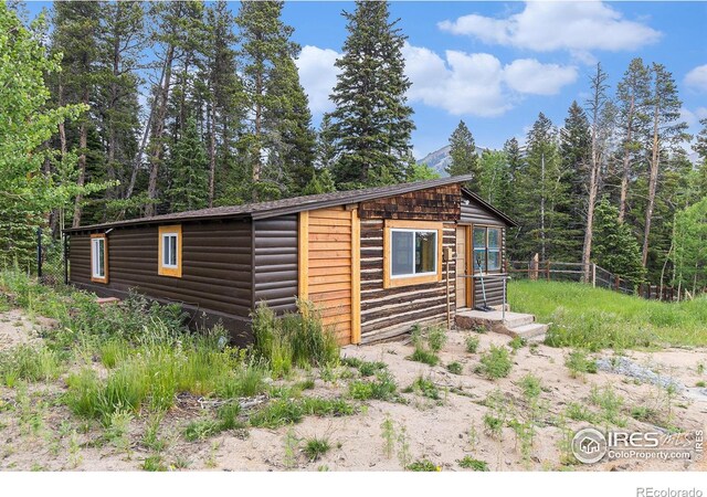 8451 Peak To Peak Hwy, Allenspark, CO 80510 - view of outdoor structure with a wooded view