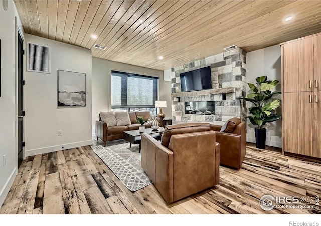 1109 Neon Forest Cir # 2, Longmont, CO 80504 - living room featuring wooden ceiling, light wood-style floors, recessed lighting, and a stone fireplace