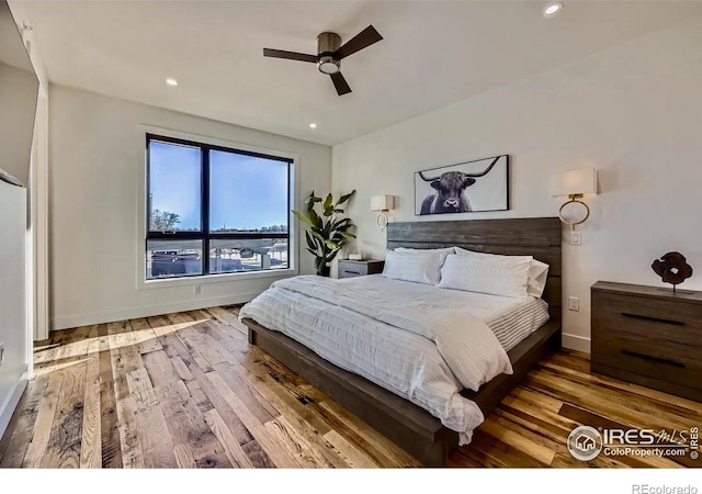 1109 Neon Forest Cir # 2, Longmont, CO 80504 - bedroom with wood finished floors, recessed lighting, and a ceiling fan