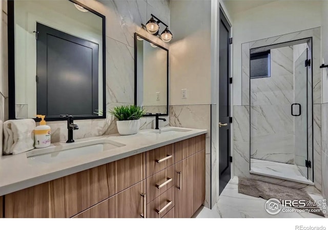 1109 Neon Forest Cir # 2, Longmont, CO 80504 - full bath with marble look tiles, double vanity, tile walls, and a marble finish shower