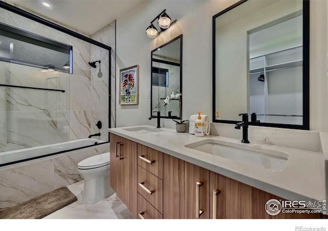 1109 Neon Forest Cir # 2, Longmont, CO 80504 - bathroom featuring marble tiled flooring, double vanity, and shower / bath combination with glass door