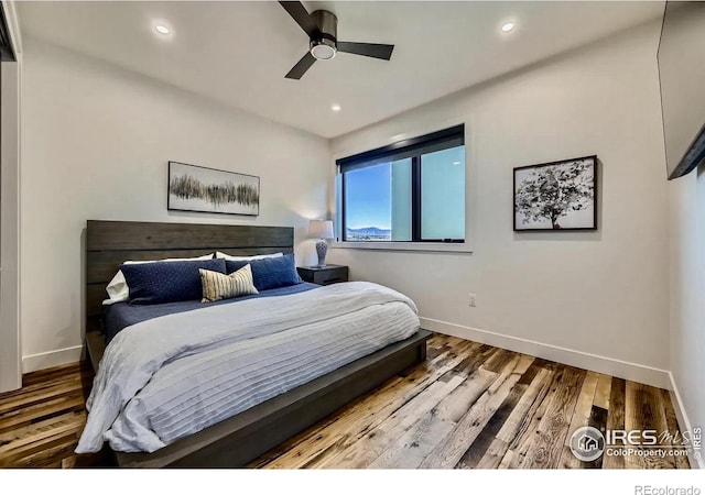 1109 Neon Forest Cir # 2, Longmont, CO 80504 - bedroom with wood finished floors, recessed lighting, and a ceiling fan