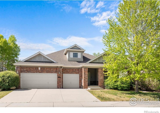 1513 Cannon Mountain Dr, Longmont, CO 80503 - view of front of property with brick siding, concrete driveway, and an attached garage