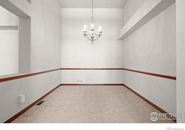 1513 Cannon Mountain Dr, Longmont, CO 80503 - empty room with carpet floors and a chandelier