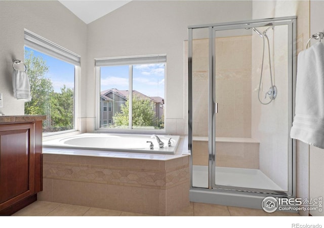 1513 Cannon Mountain Dr, Longmont, CO 80503 - full bath featuring tile patterned flooring, a garden tub, a stall shower, and lofted ceiling