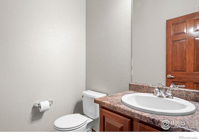 1513 Cannon Mountain Dr, Longmont, CO 80503 - bathroom with vanity and a textured wall