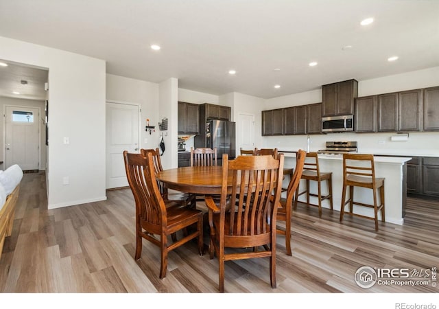 3775 Ginkgo St, Wellington, CO 80549 - dining space featuring light wood finished floors and recessed lighting