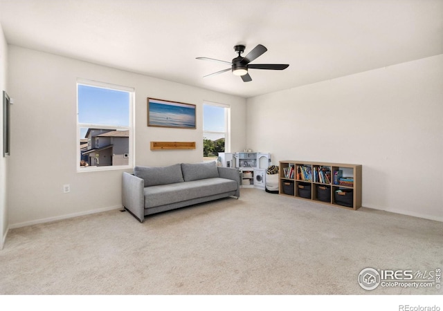 3775 Ginkgo St, Wellington, CO 80549 - carpeted living room featuring ceiling fan and baseboards