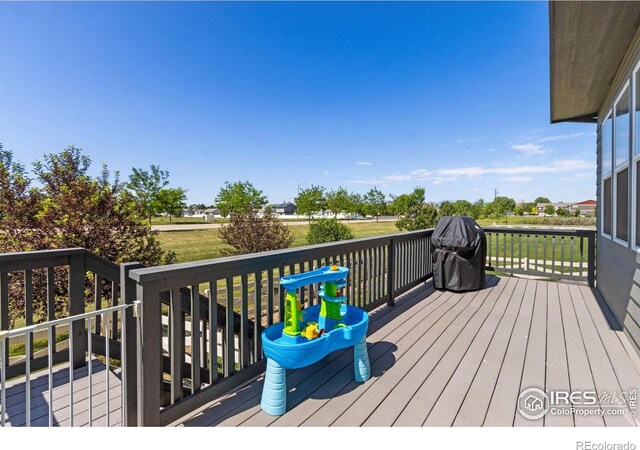 3775 Ginkgo St, Wellington, CO 80549 - wooden deck with area for grilling