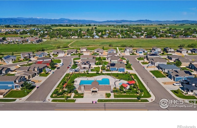 3775 Ginkgo St, Wellington, CO 80549 - aerial perspective of suburban area featuring a mountain backdrop and a pool area