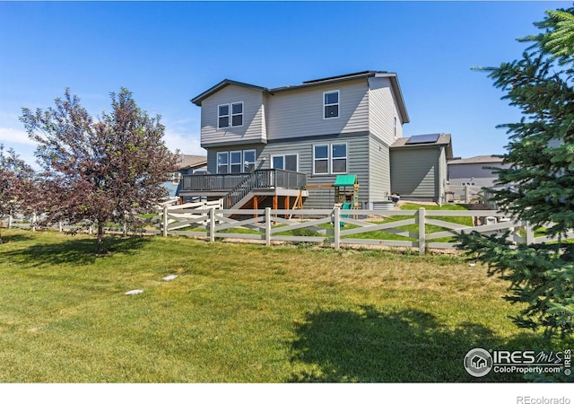 3775 Ginkgo St, Wellington, CO 80549 - rear view of property featuring a wooden deck, a fenced backyard, and stairs