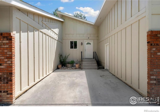 3012 Anchor Way Unit 3, Fort Collins, CO 80525 - property entrance with board and batten siding and a patio area