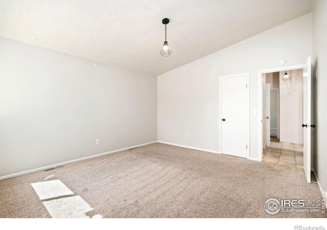 3012 Anchor Way Unit 3, Fort Collins, CO 80525 - empty room with carpet floors, lofted ceiling, and a textured ceiling