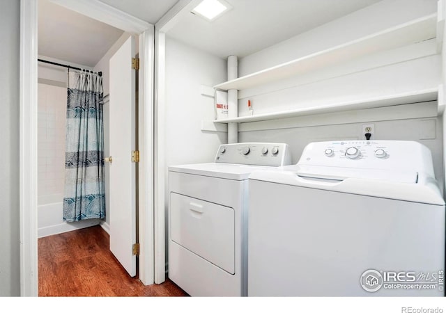 3012 Anchor Way Unit 3, Fort Collins, CO 80525 - washroom with washing machine and clothes dryer and wood finished floors