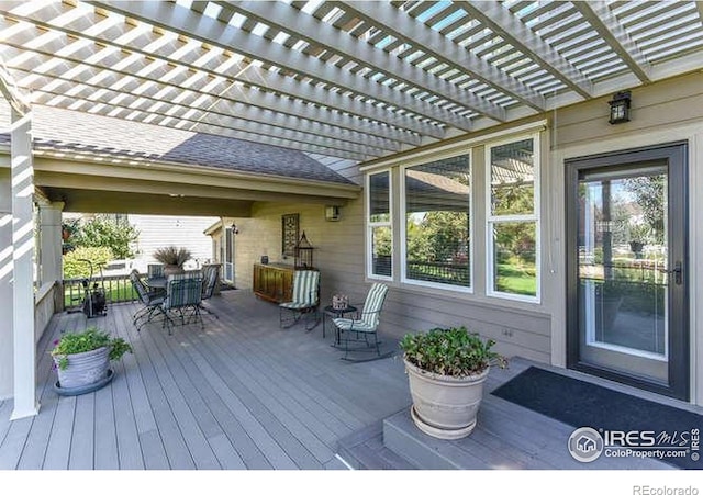 8356 Louden Circle Ft, Collins, CO 80528 - wooden terrace featuring outdoor dining space and a pergola