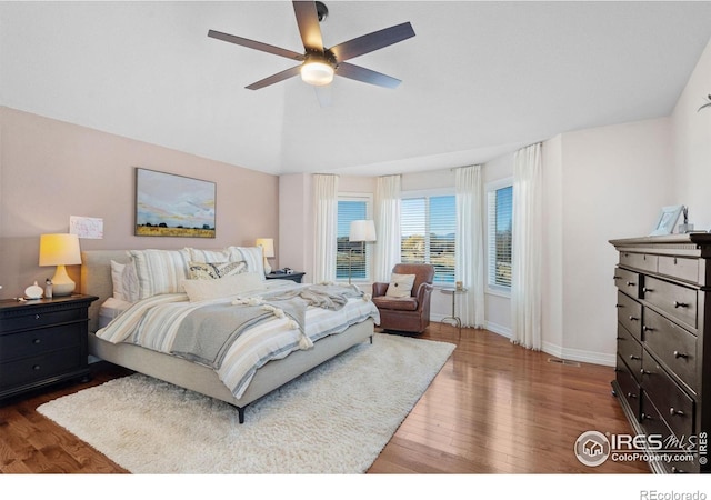 8356 Louden Circle Ft, Collins, CO 80528 - bedroom featuring wood finished floors, vaulted ceiling, and a ceiling fan