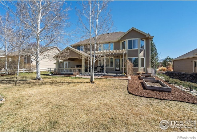 8356 Louden Circle Ft, Collins, CO 80528 - rear view of property featuring a pergola, a lawn, a patio, and a vegetable garden