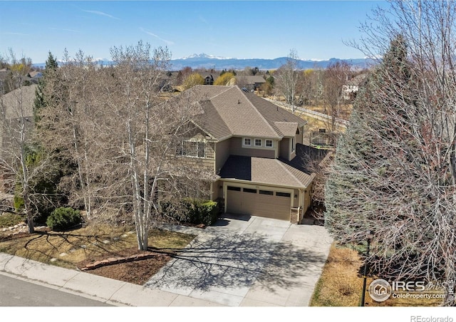 8356 Louden Circle Ft, Collins, CO 80528 - view of front of property featuring roof with shingles, concrete driveway, and a mountain view