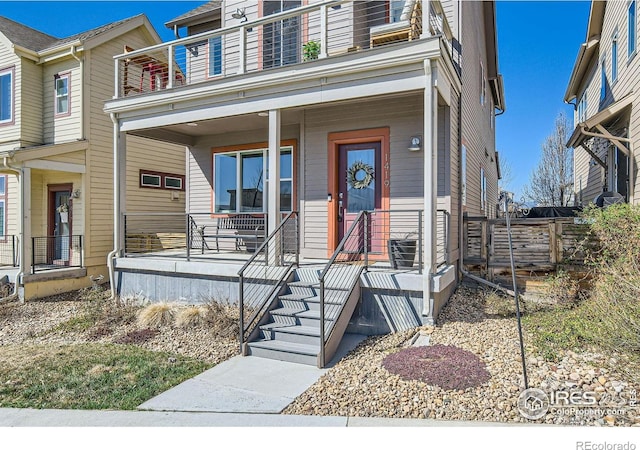 1419 W 67th Ave, Denver, CO 80221 - view of front of property featuring a balcony and covered porch