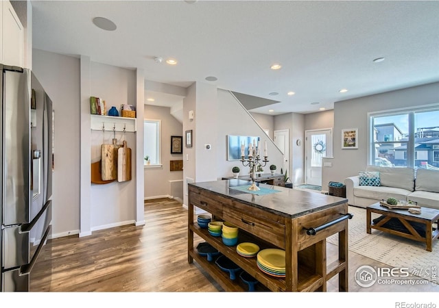 1419 W 67th Ave, Denver, CO 80221 - kitchen featuring stainless steel fridge, wood finished floors, white cabinets, recessed lighting, and open shelves