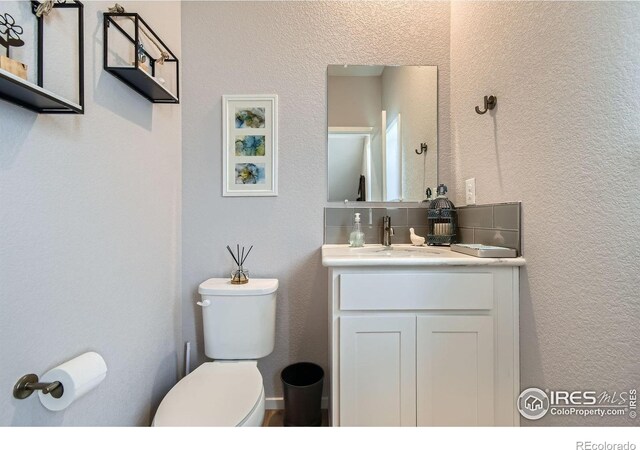 1419 W 67th Ave, Denver, CO 80221 - bathroom with vanity and a textured wall