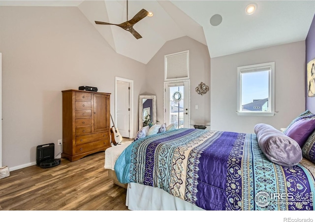 1419 W 67th Ave, Denver, CO 80221 - bedroom with multiple windows, wood finished floors, vaulted ceiling, and a ceiling fan