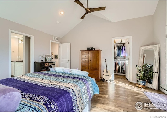 1419 W 67th Ave, Denver, CO 80221 - bedroom featuring wood finished floors, a spacious closet, a closet, high vaulted ceiling, and a ceiling fan