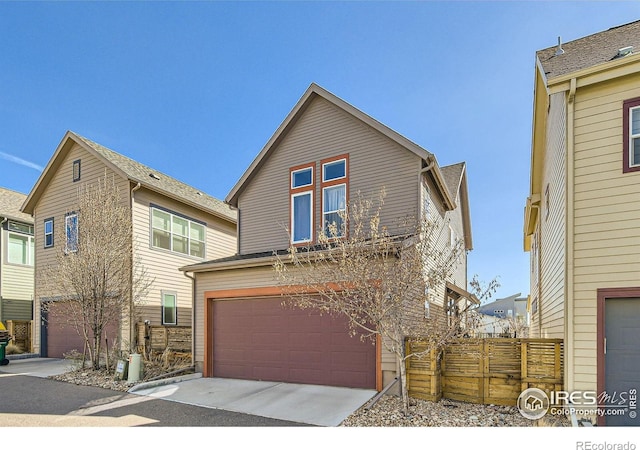 1419 W 67th Ave, Denver, CO 80221 - view of front of home featuring a garage and driveway