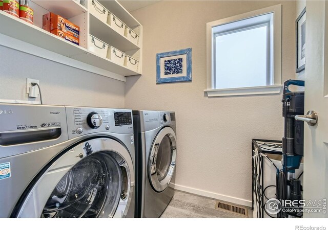 1419 W 67th Ave, Denver, CO 80221 - laundry area with washer and clothes dryer and baseboards