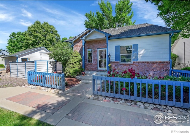 3132 Concord Way, Longmont, CO 80503 - ranch-style house featuring brick siding and an outbuilding