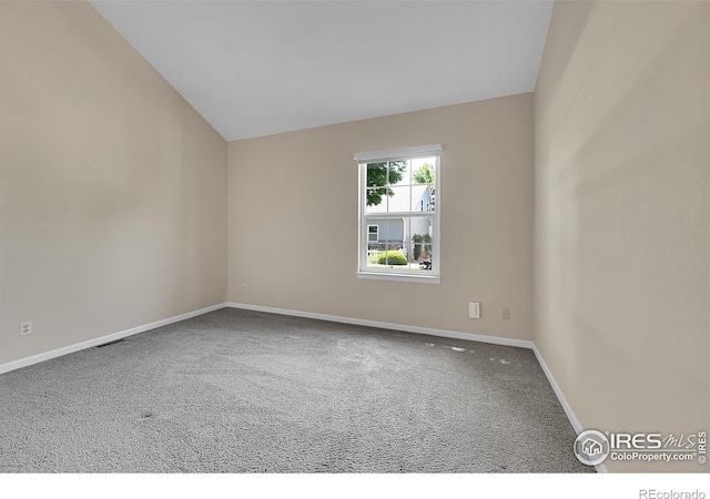 3132 Concord Way, Longmont, CO 80503 - carpeted empty room featuring baseboards and vaulted ceiling