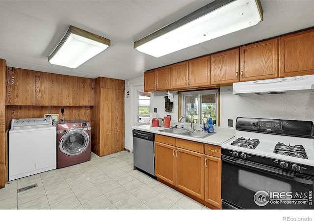 18247 County Road 22, Fort Lupton, CO 80621 - kitchen with range with gas cooktop, dishwasher, under cabinet range hood, washing machine and clothes dryer, and light countertops
