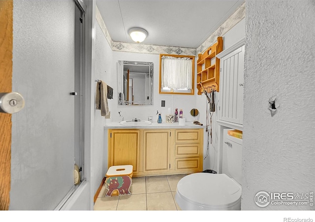 18247 County Road 22, Fort Lupton, CO 80621 - bathroom featuring tile patterned floors, vanity, and a textured wall