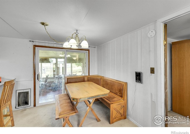 18247 County Road 22, Fort Lupton, CO 80621 - dining room featuring a chandelier, breakfast area, and light carpet