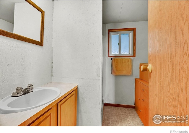 18247 County Road 22, Fort Lupton, CO 80621 - bathroom with vanity and tile patterned floors