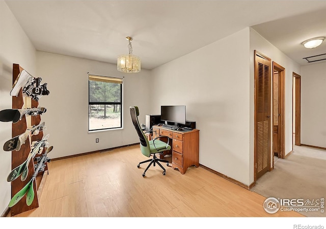 56 Bounty Hunter Ln, Bailey, CO 80421 - home office with a chandelier and light wood-type flooring