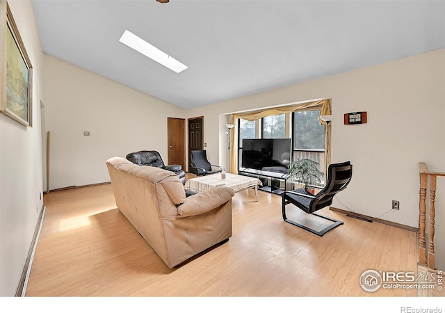 56 Bounty Hunter Ln, Bailey, CO 80421 - living area featuring light wood-style flooring, lofted ceiling, and a skylight