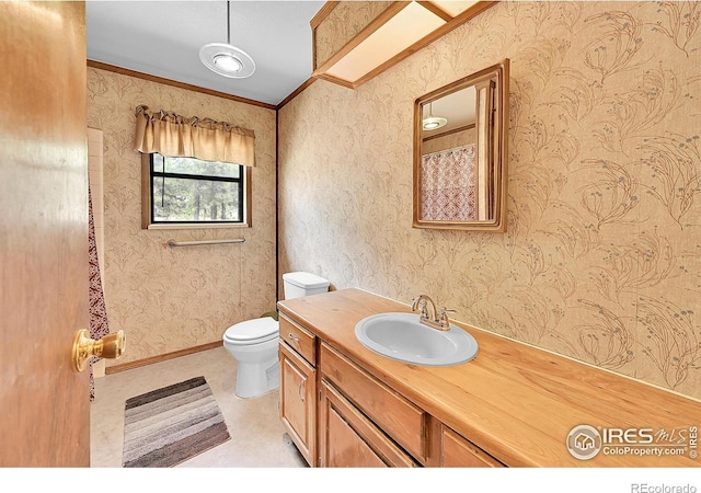 56 Bounty Hunter Ln, Bailey, CO 80421 - bathroom with wallpapered walls, vanity, and ornamental molding
