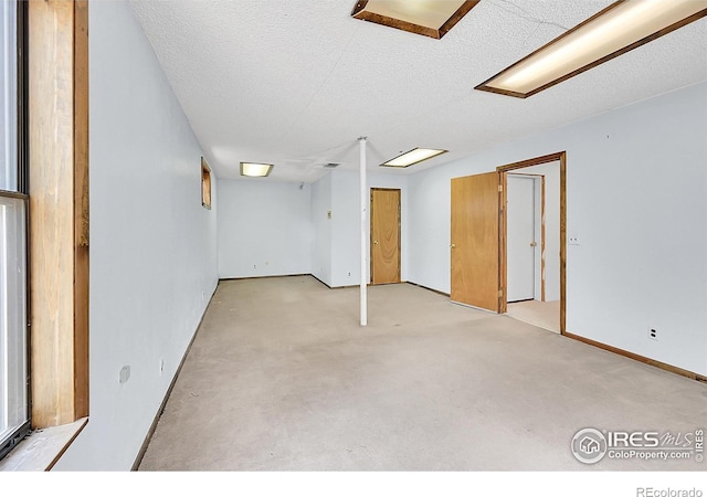 56 Bounty Hunter Ln, Bailey, CO 80421 - finished basement featuring light carpet and a textured ceiling
