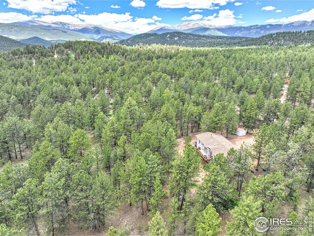56 Bounty Hunter Ln, Bailey, CO 80421 - aerial view of property and surrounding area with a heavily wooded area and mountains