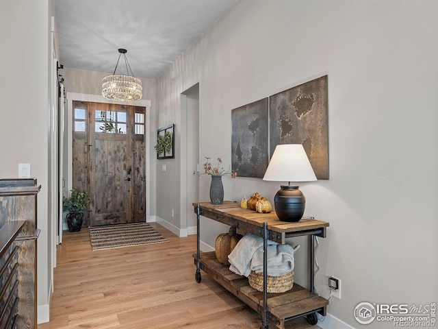 1255 Eliza Ave, Berthoud, CO 80513 - foyer featuring a chandelier and light wood-style flooring