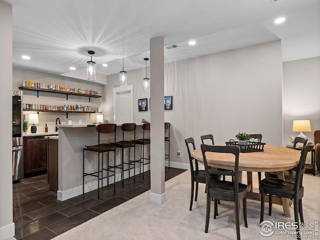 1255 Eliza Ave, Berthoud, CO 80513 - dining room featuring bar with sink and recessed lighting