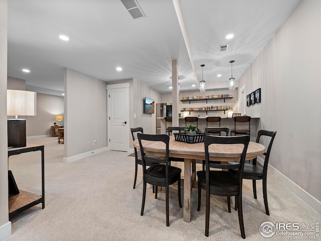 1255 Eliza Ave, Berthoud, CO 80513 - dining space with bar area, recessed lighting, and light colored carpet