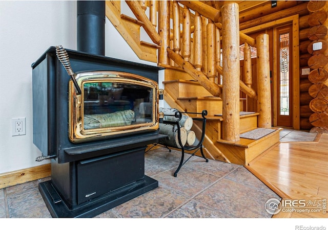 178 Hazelwood Dr, Nederland, CO 80466 - detailed view of log walls and a wood stove